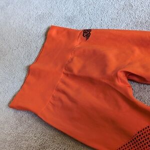 Body Engineer orange leggings